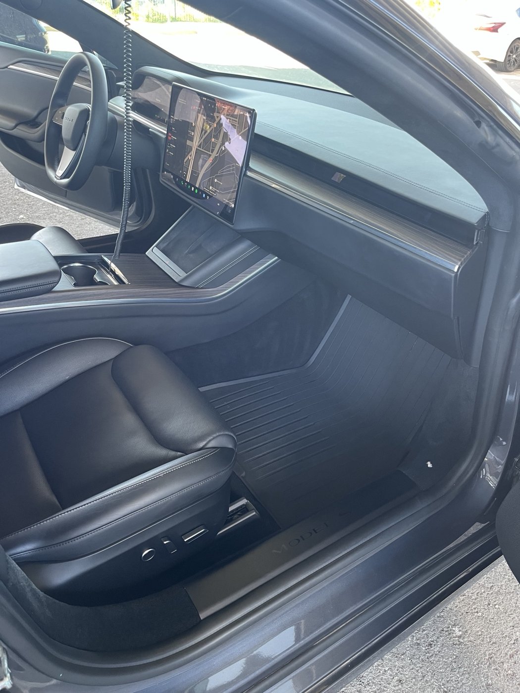 Clean black leather passenger seat and dashboard